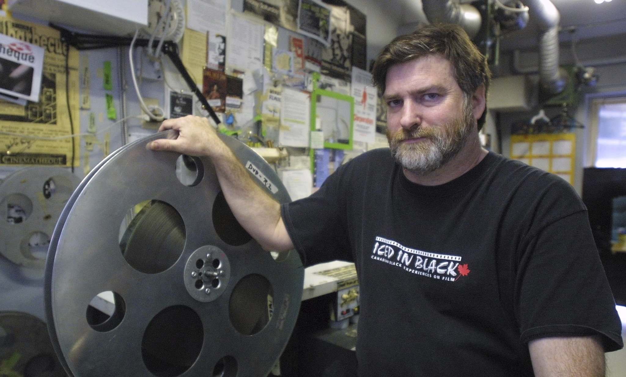 Cinematheque’s Dave Barber in the projection room in 2004; the longtime programmer became synonymous with the Art Space theatre. (Mike Deal / Winnipeg Free Press files)