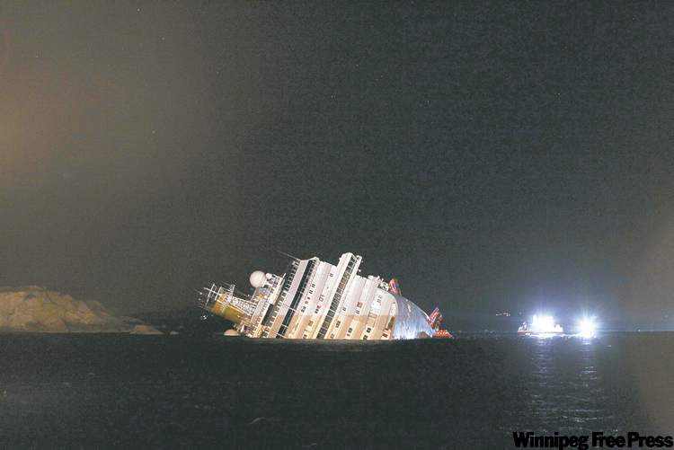 GREGORIO BORGIA / THE ASSOCIATED PRESS
The luxury cruise ship Costa Concordia lies on its side after running aground off the tiny Tuscan island of Giglio, Italy.