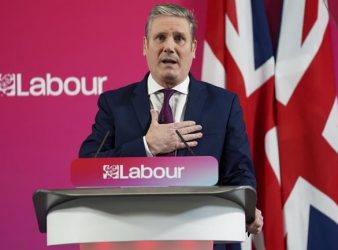 Britain's Labour leader Keir Starmer makes his keynote speech in Birmingham, England, Tuesday, Jan. 4, 2021, setting out his party's ambition for a new Britain. (Jacob King/PA via AP)