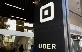 People make their way into the building that houses the headquarters of Uber, Wednesday, June 21, 2017, in San Francisco. Uber Technologies Inc. has signed an agreement with a private sector union that will provide representation to Canadian drivers and couriers, but the deal stops short of unionizing workers. THE CANADIAN PRESS/AP-Eric Risberg