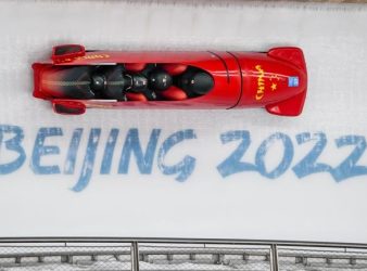 Li Chunjian, Ding Song, Ye Jielong and She Hao, of China, slide during the 4-man heat 1 at the 2022 Winter Olympics, Saturday, Feb. 19, 2022, in the Yanqing district of Beijing. (AP Photo/Pavel Golovkin)