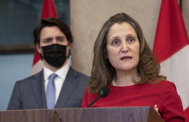 Prime Minister Justin Trudeau looks on as Deputy Prime Minister and Finance Minister Chrystia Freeland speaks following a cabinet retreat, Wednesday, Jan. 26, 2022 in Ottawa. THE CANADIAN PRESS/Adrian Wyld