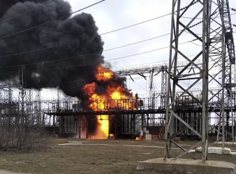 In this handout photo provided by Ukraine's Emergency Situation Ministry, flames and smoke rise from the thermal power plant, which, according to local authorities, was damaged by shelling, near the frontline in the town of Shchastia in the Luhansk region, Ukraine, Tuesday, Feb. 22, 2022. (Emergency Situation Ministry via AP)
