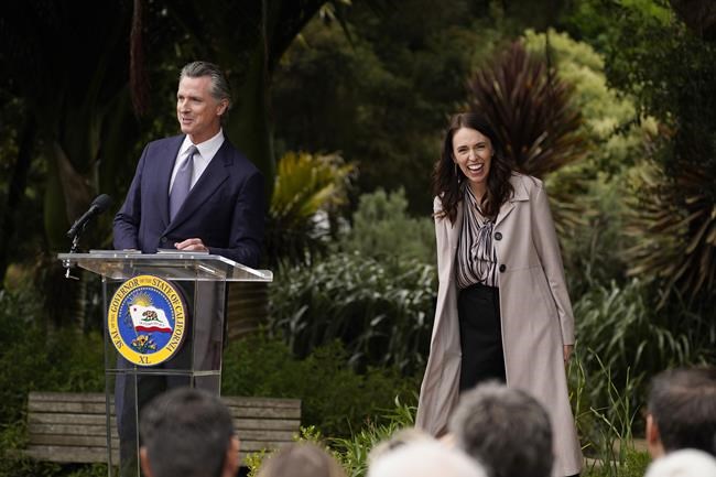 California Gov. Gavin Newsom and New Zealand Prime Minister Jacinda Ardern prepare to take questions after an event at the San Francisco Botanical Garden in San Francisco, Friday, May 27, 2022. Gov. Newsom met with Ardern in Golden Gate Park "to establish a new international partnership tackling climate change." (AP Photo/Eric Risberg)