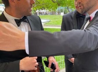 Kelvin Redvers, left, is seen being ejected by a security guard, right, from the Cannes red carpet, in Cannes, France, in a May 22, 2022, handout photo. Redvers, a Dene filmmaker, says he was turned away from a Cannes Film Festival red carpet for wearing moccasins. THE CANADIAN PRESS/HO-Kelvin Redvers, *MANDATORY CREDIT*