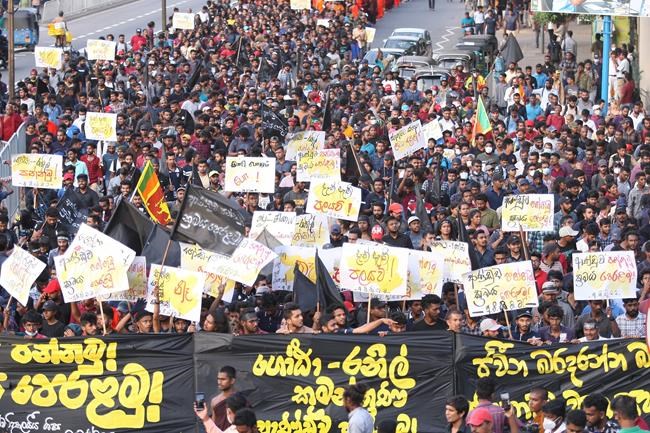 Students shout anti government slogans during protest march in Colombo, Sri Lanka, Friday, July 8, 2022. (AP Photo/Amitha Thennakoon)