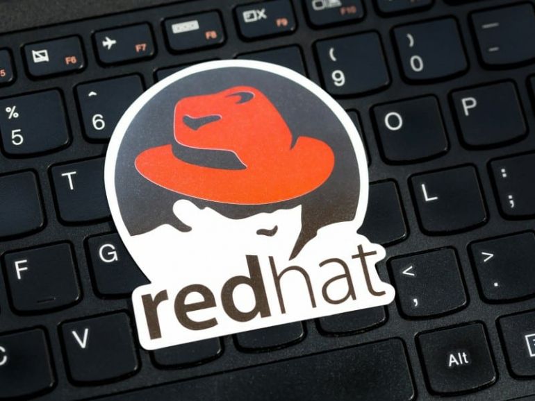 RHEL OS, Red Hat Enterprise Linux operating system commercial market distribution logo, symbol, sticker on a laptop keyboard.